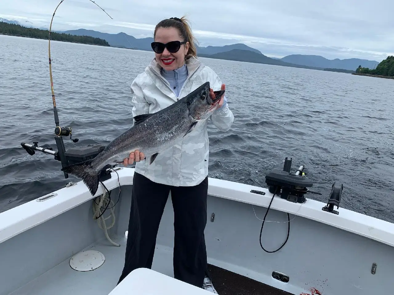 A Guest holding her catch of the day